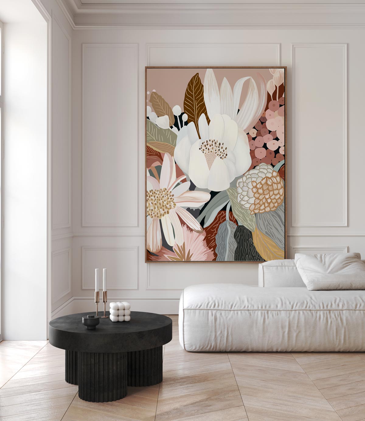 A framed canvas print titled 'Harmony', featuring a floral composition with earthy tones, displayed in a room with a white sofa and a black side table.