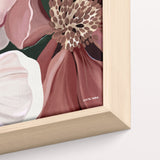 Framed artwork of a floral design with a gold border on a white background