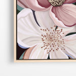 Framed floral artwork with a close-up of a flower on a white background