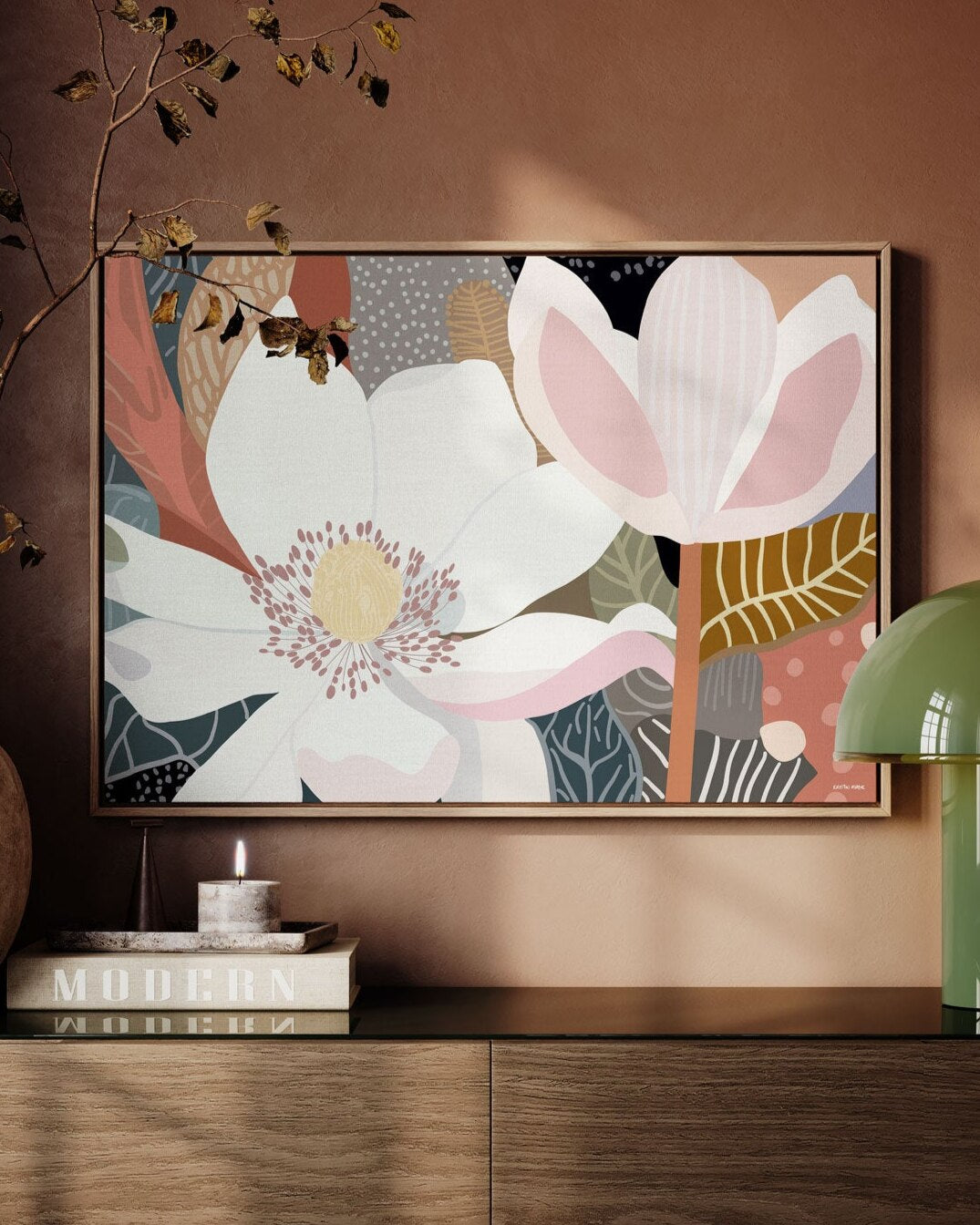 A framed canvas print depicting an abstract floral design, displayed in a home setting.