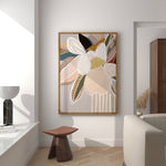 A framed canvas print titled 'Elodie In Neutral No.2' featuring abstract florals in soft neutral tones, displayed in a modern interior setting.