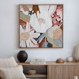 A framed canvas print titled 'Harmony No.2', featuring abstract floral forms in various colors on a living room wall.