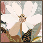 A framed canvas print of an abstract floral artwork featuring a magnolia flower with a calming palette, displayed above a wooden cabinet with a plant and a lamp on either side.