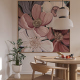 Dining room with floral artwork on the wall, wooden table, and chairs.
