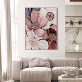 Living room with a floral painting on the wall above a beige sofa.