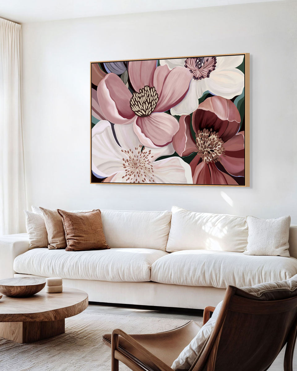 Floral artwork above a white sofa in a living room