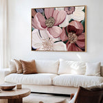 Floral artwork above a white sofa in a living room