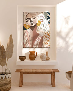 A framed canvas print titled 'Cala Luna', depicting an abstract image with flowing forms and soft, shadowed colors, displayed on a white wall above a bench with decorative pots and bottles.