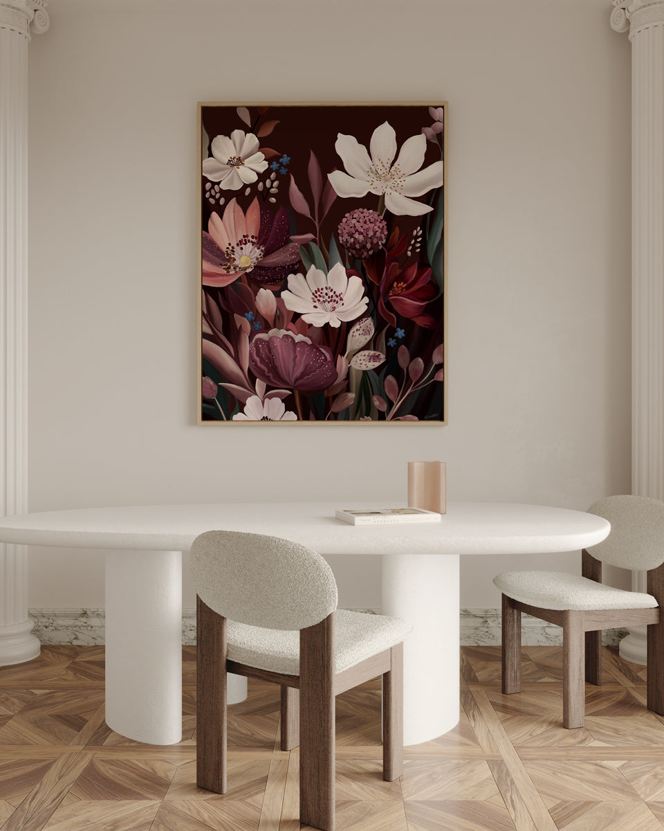 Dining room with a floral painting on the wall, white table, and chairs.