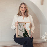 Woman holding a framed abstract art piece in a modern interior setting. Odeletta No.2