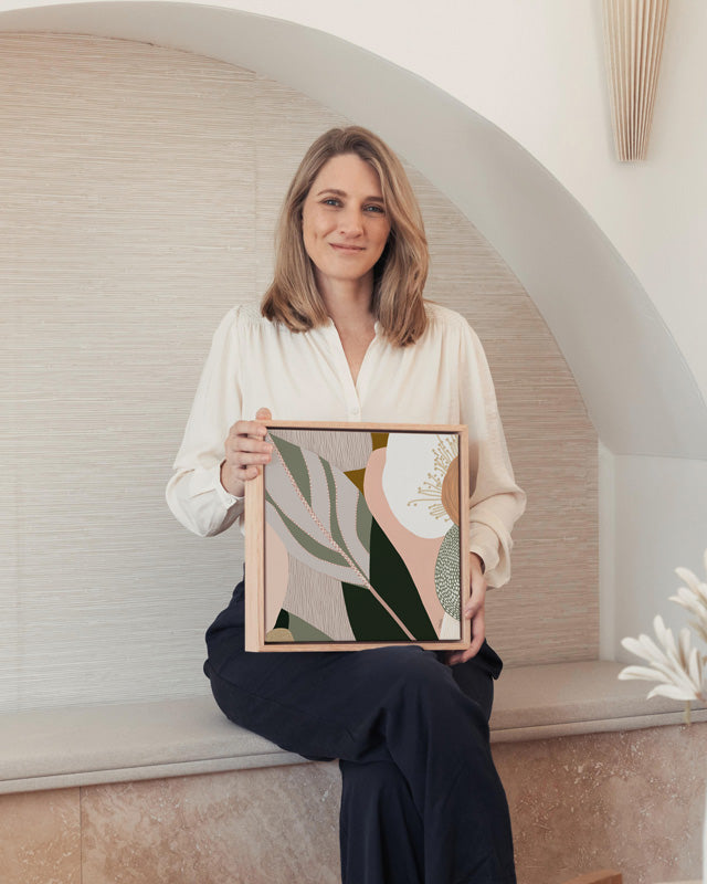Woman holding a framed abstract art piece in a modern interior setting. Odeletta No.2