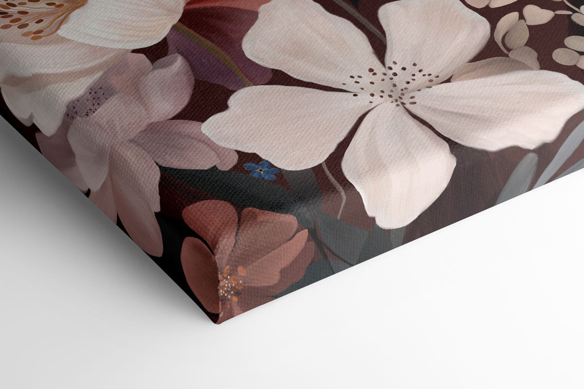 A close-up of a stretched canvas featuring large cream and dusty pink flowers with brown and muted purple accents on a dark background, shown folded over on a white surface.