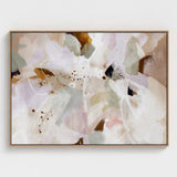 Abstract floral painting in a oak frame on a white wall