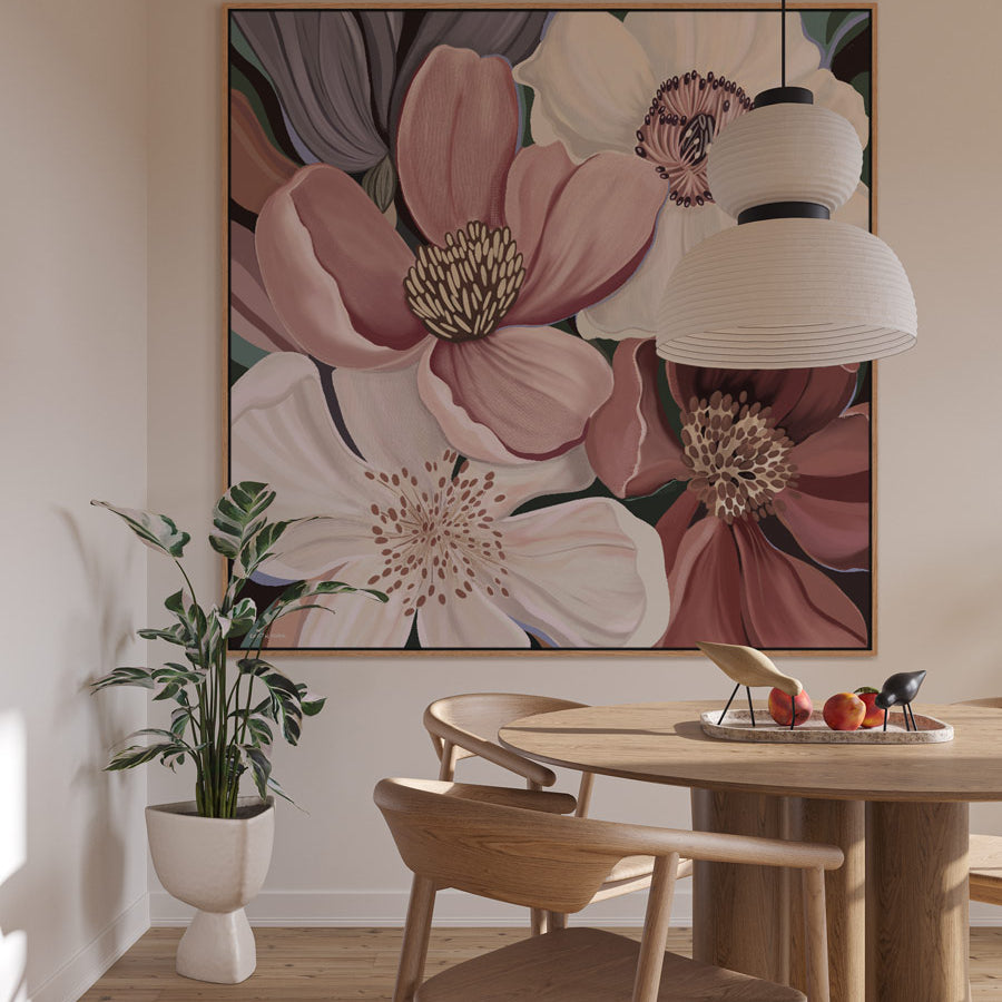 Dining room with floral artwork on the wall, wooden table, and chairs.
